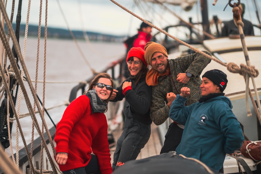 Michał with 3 happy crew members celebrating successful sailing manouver